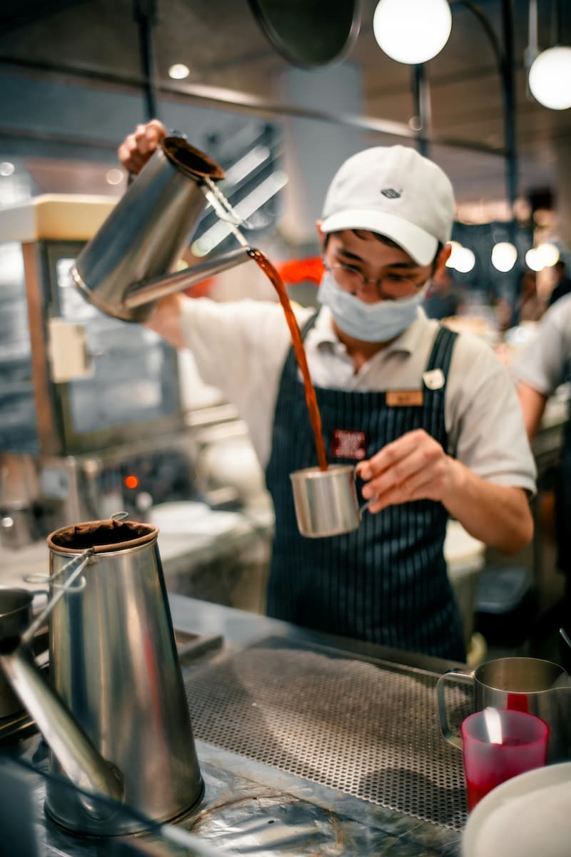 Row of Singapore kopitiam drinks — kopi, teh, milo on a marble table